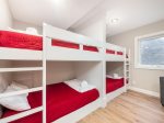 Full/Double bunk beds in basement area provide sleeping for up to 8